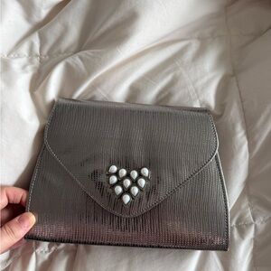 Elegant Silver Clutch with Pearl Accents